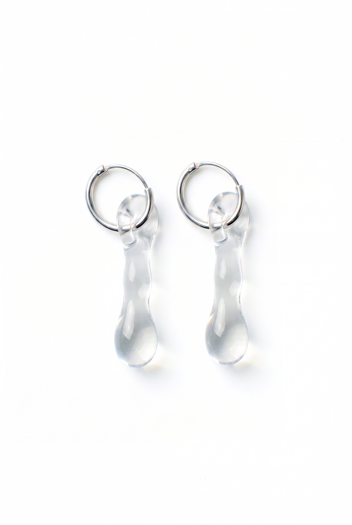 Rain and Rivers Mini Hoop Earrings 0012 – pair of small hand-sculpted clear borosilicate glass drop earrings on steel hoops, handmade in Barcelona, product photo on white