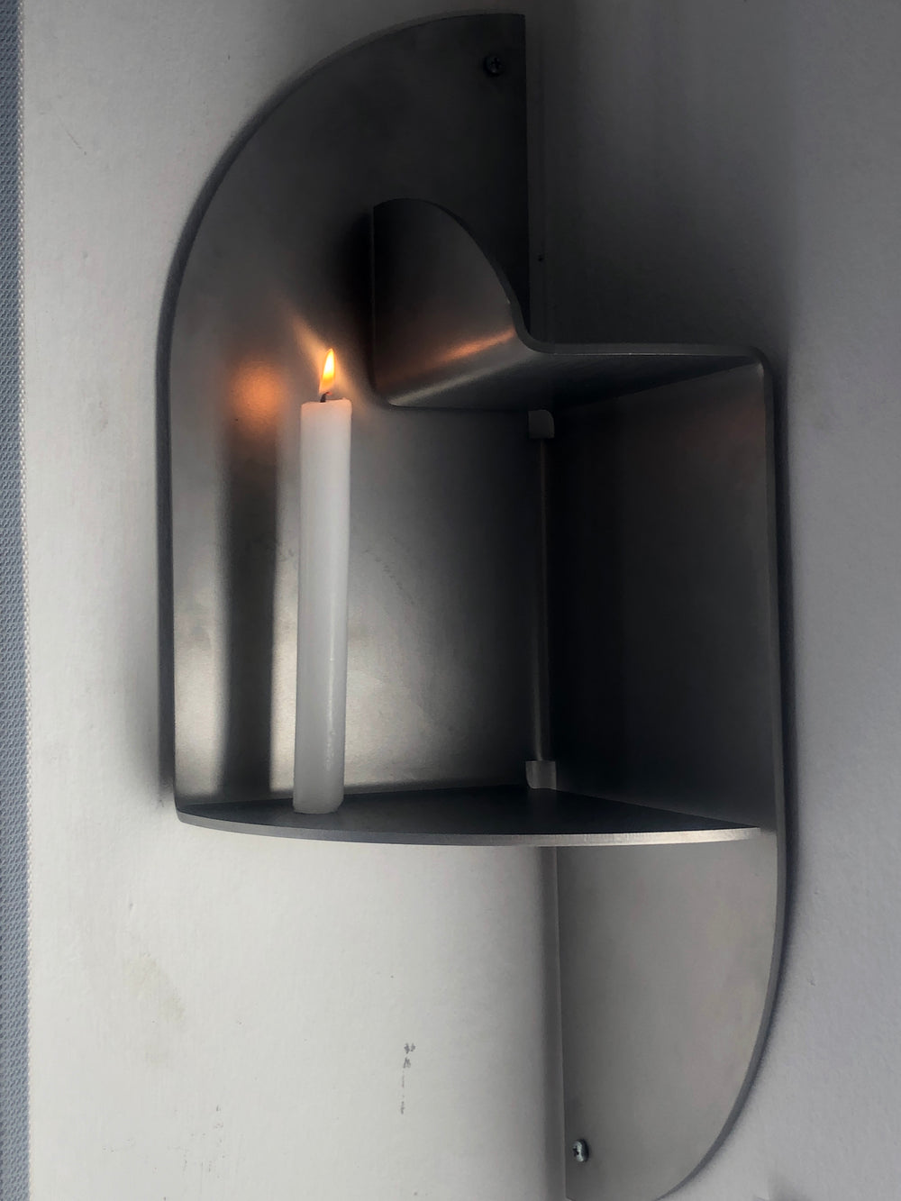 Corner Shelf 001 in stainless steel by Rain and Rivers