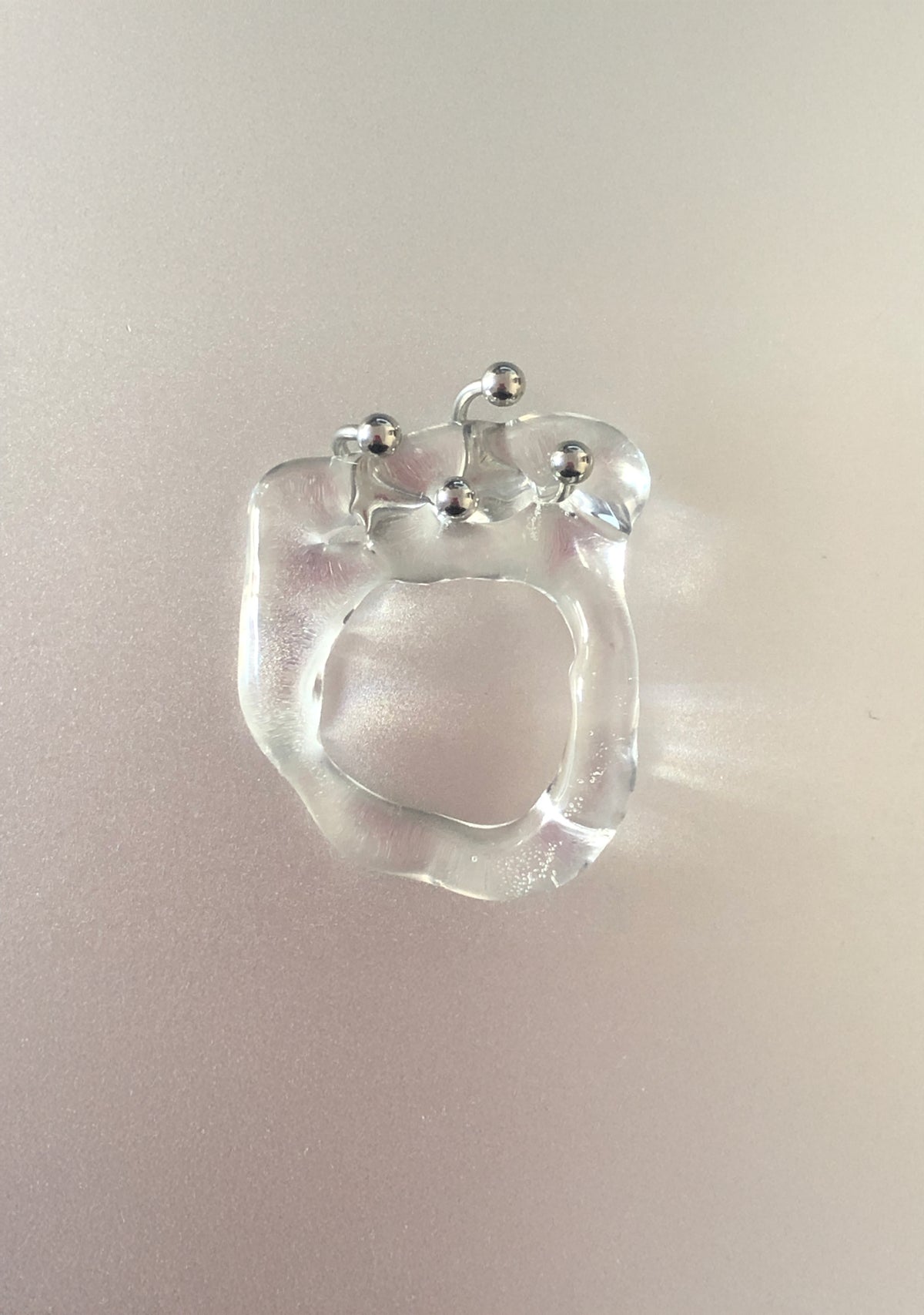 Double Pierced Glass Ring 0021, clear glass with two stainless steel horseshoe piercings, detail, Rain and Rivers