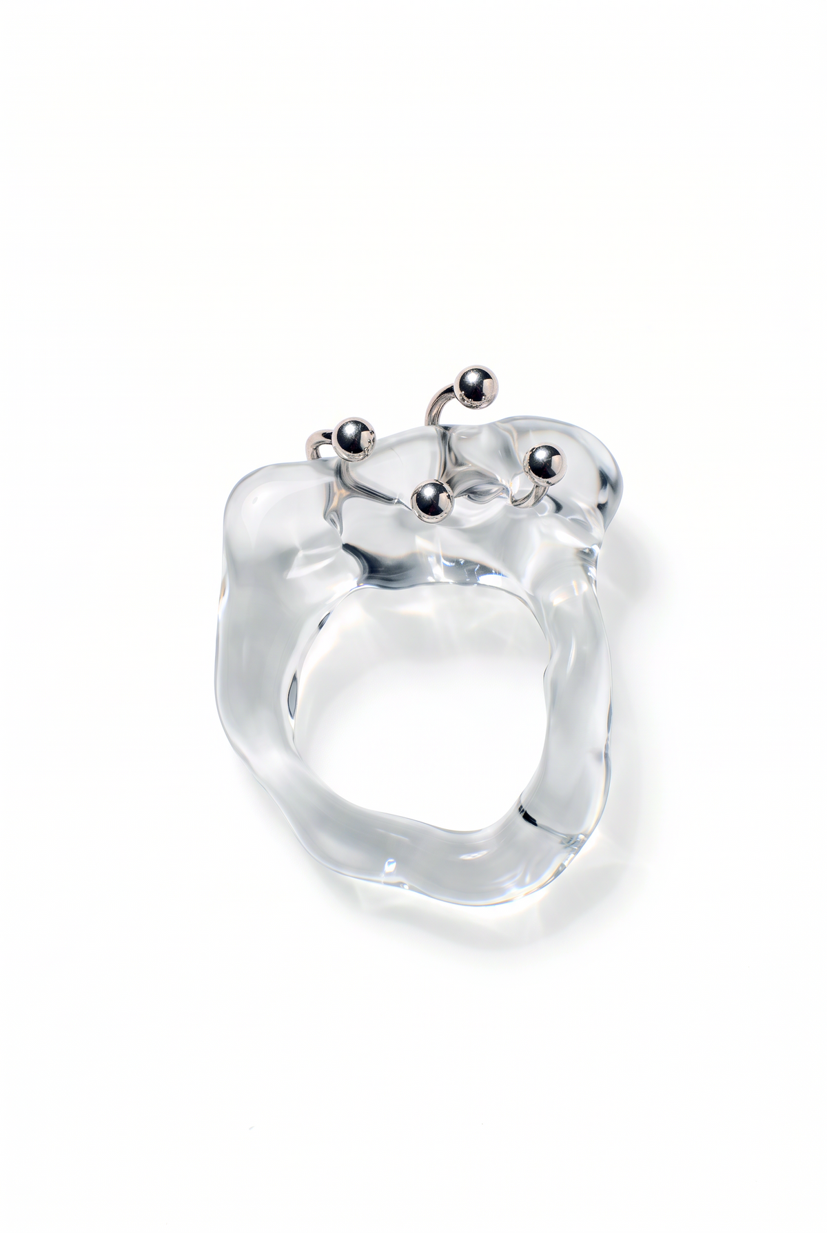 Rain and Rivers Double Pierced Glass Ring 0021 – hand-sculpted clear borosilicate glass ring with two stainless steel horseshoe piercings, handmade in Barcelona, product photo on white