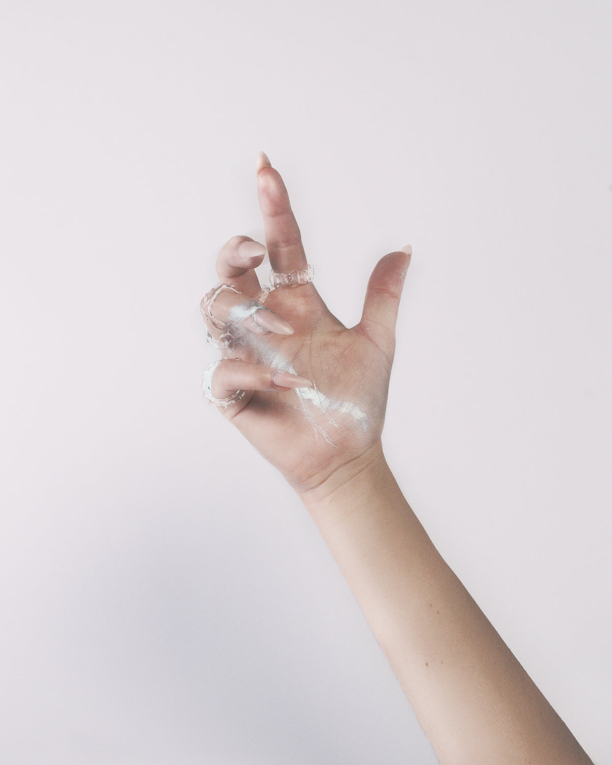 Textured Stacking Glass Rings 0124 in hand-sculpted borosilicate glass, worn layered on the hand, Rain and Rivers