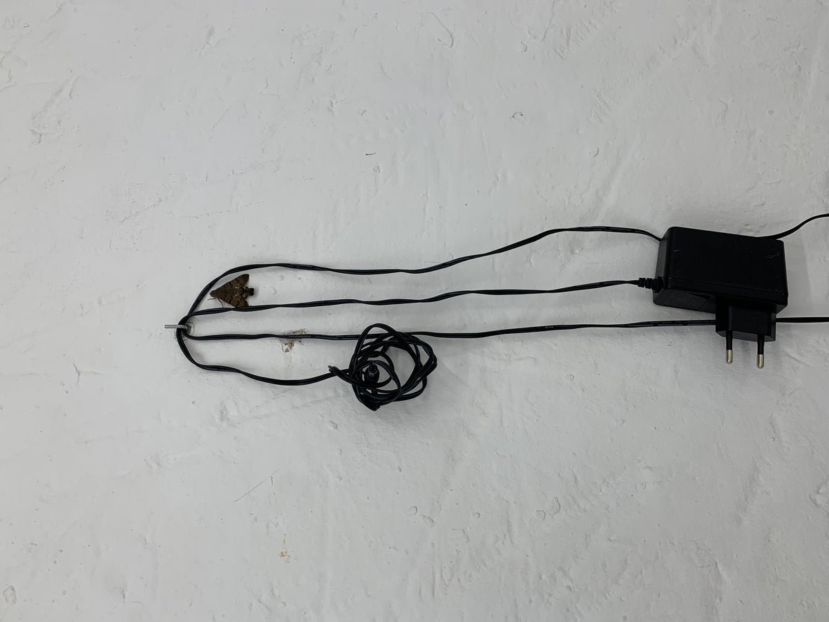 Blown glass tubes connected to a small electronic device, a sensitive device by Magdalena Hart